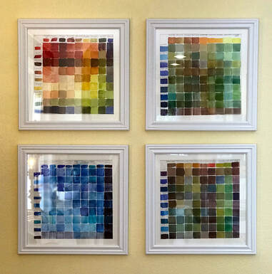 watercolor mix charts framed and mounted on a wall 
